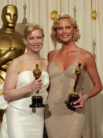 Actresses Charlize Theron, right, and Renee Zellweger holds the Oscars they won for best actress for Theron's work in Monster and best supporting actress for Zellweger's work in Cold Mountain at the 76th annual Academy Awards, Los Angeles, February 29, 2004.